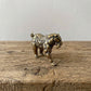 The Resilient Provider miniature brass polar bear carrying a fish, showing detailed fur texture and warm aged patina, from the WILLAGE Tiny Objects collection