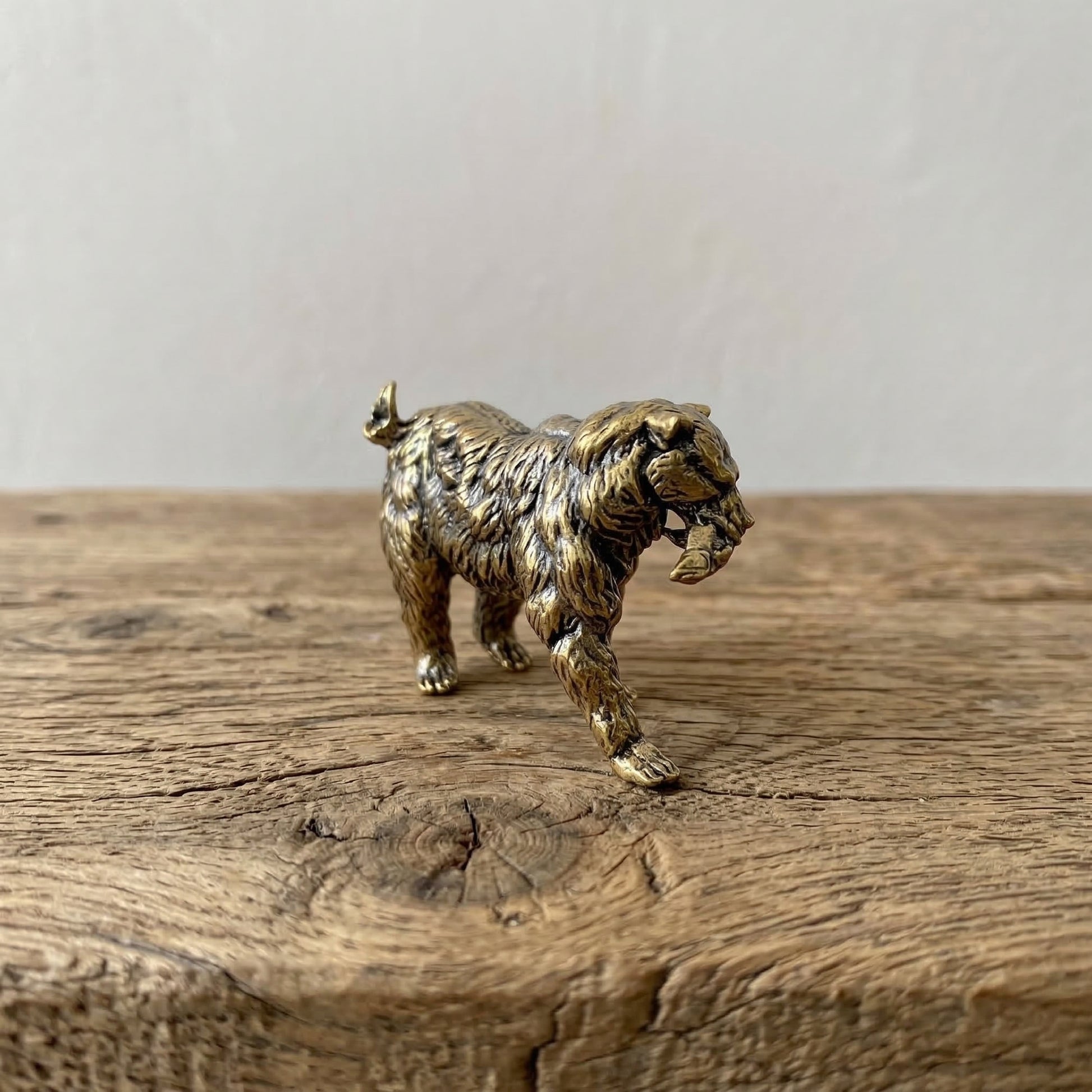 The Resilient Provider miniature brass polar bear carrying a fish, showing detailed fur texture and warm aged patina, from the WILLAGE Tiny Objects collection