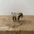 The Resilient Provider miniature brass polar bear carrying a fish, showing detailed fur texture and warm aged patina, from the WILLAGE Tiny Objects collection
