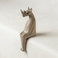 The Resting Rhino hand-carved wooden shelf sitter showing painted detail and wood grain texture against a neutral background