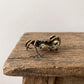 Brass mitten crab figurine with jointed legs and stippled shell, antique patina finish