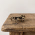 Brass mitten crab figurine with jointed legs and stippled shell, antique patina finish