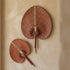 Handwoven rontal palm leaf fan with leather-wrapped handle, hand-braided by artisans in Bali Indonesia, from WILLAGE