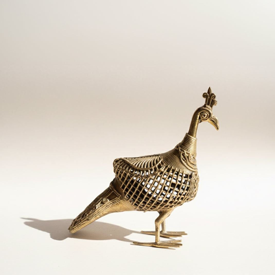 The Royal Odisha Peacock Dhokra metal sculpture showing detailed lost-wax cast tail feathers and textured surface, handcrafted in Odisha India, from WILLAGE