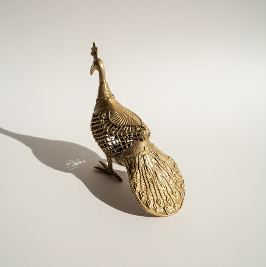 Side view of The Royal Odisha Peacock Dhokra sculpture showing full body and cast metal latticework