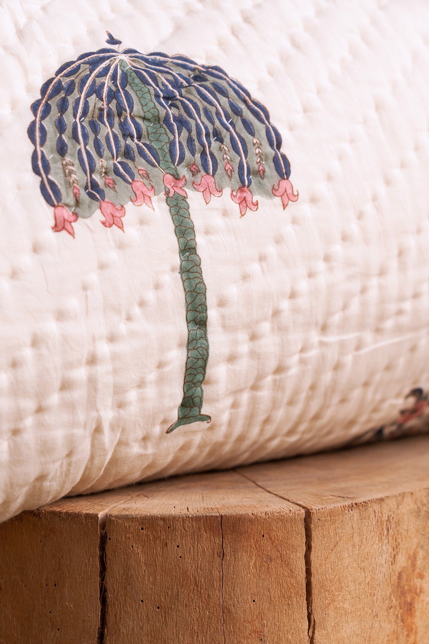 Hand block-printed royal umbrella motif on cotton quilt, showing dye saturation and artisan stitching, from WILLAGE