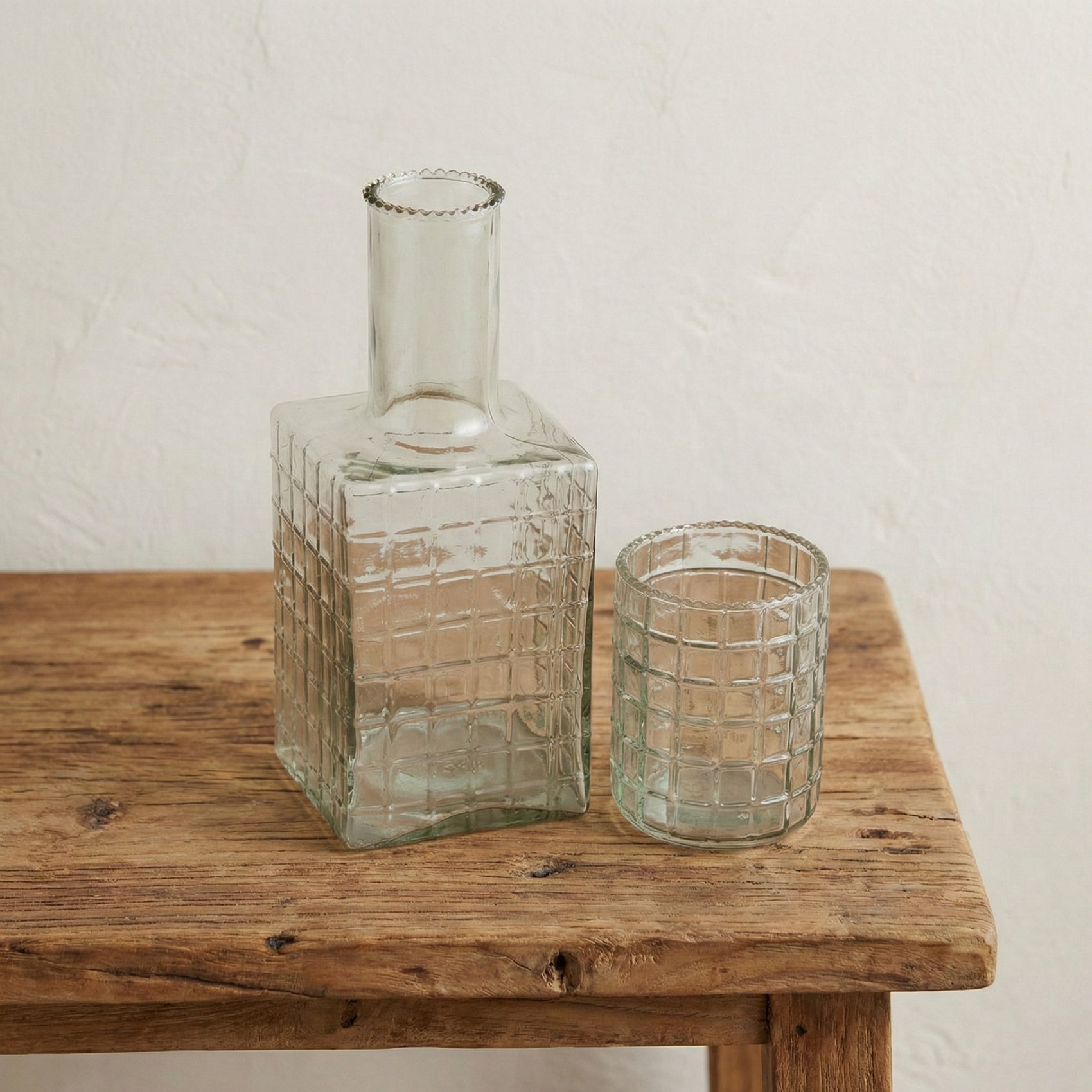 Ruffle glass bedside carafe and tumbler set showing undulating ribbed texture on clear handblown glass, handcrafted in India, from WILLAGE
