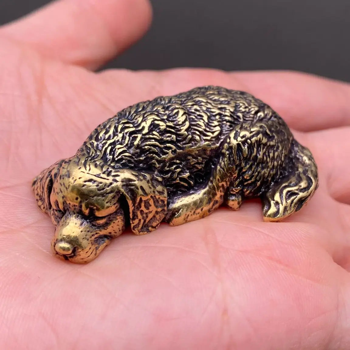 The Serene Soul miniature brass golden retriever curled nose-to-tail in sleeping pose, with warm aged patina, from the WILLAGE Tiny Objects collection