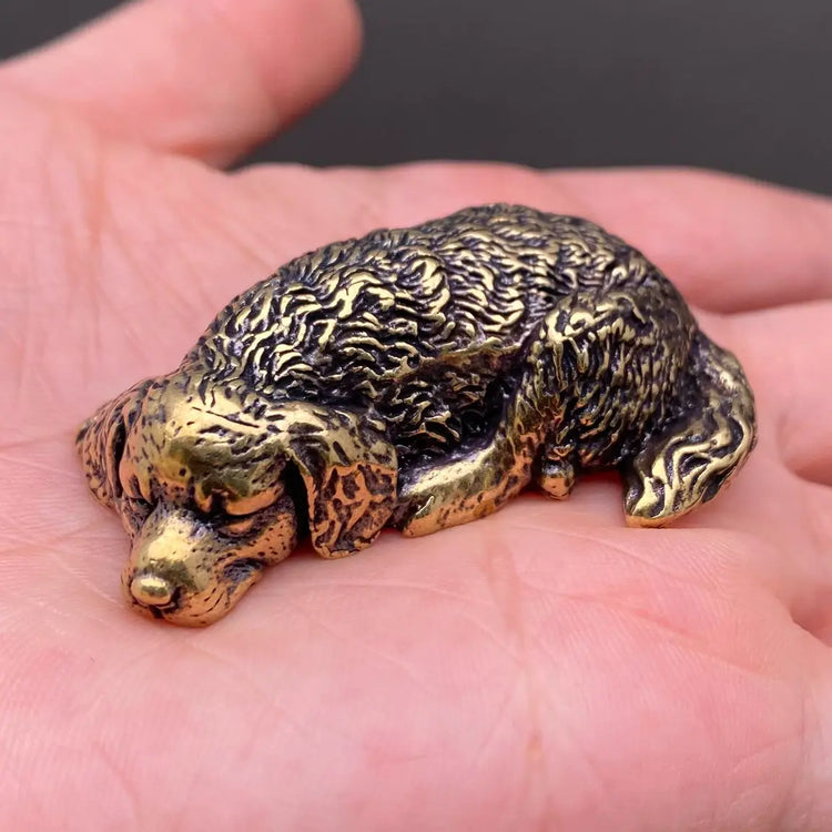 The Serene Soul miniature brass golden retriever curled nose-to-tail in sleeping pose, with warm aged patina, from the WILLAGE Tiny Objects collection