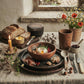 Sung black clay cereal bowl displayed in a styled table setting with other Sung Valley pottery pieces