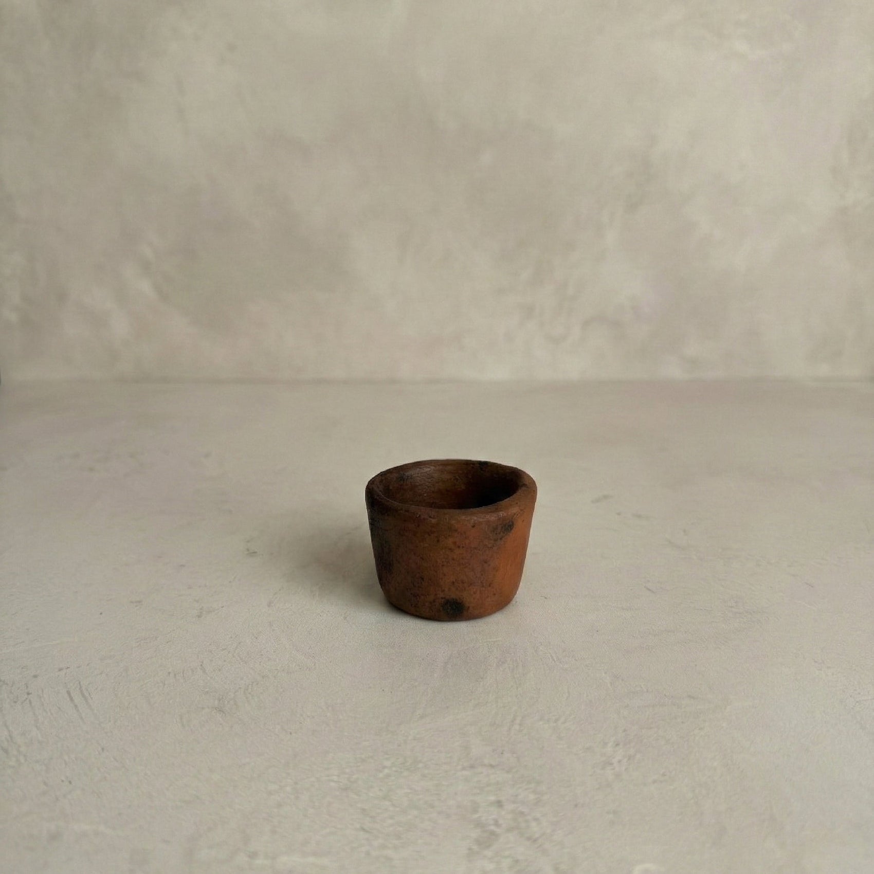 Sung Pinch Pot in black clay showing small hand-formed vessel with unglazed surface, Lyrnai pottery from Meghalaya India, from WILLAGE