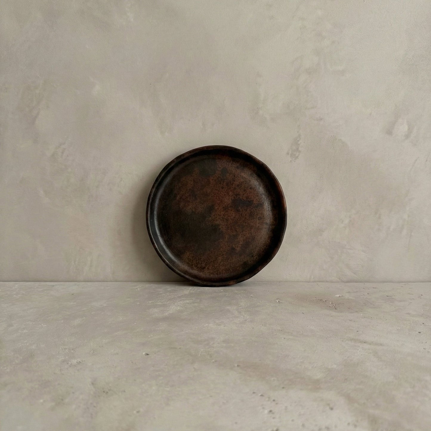 Sung side plate in handcrafted black clay showing rounded form and burnished surface, Lyrnai pottery from Meghalaya India, from WILLAGE