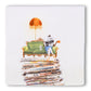 Taking My Time Storytile showing illustration of a reader on top of a stack of newspapers drinking coffee, hand-baked ceramic by Marga van Oers