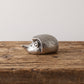 Miniature pewter hedgehog netsuke resting