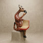 The Thinking Giraffe hand-carved wood shelf sitter sculpture reading a book with hand-painted spots