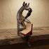 The Thinking Zebra hand-carved wood shelf sitter sculpture reading a red book with hand-painted black and white stripes
