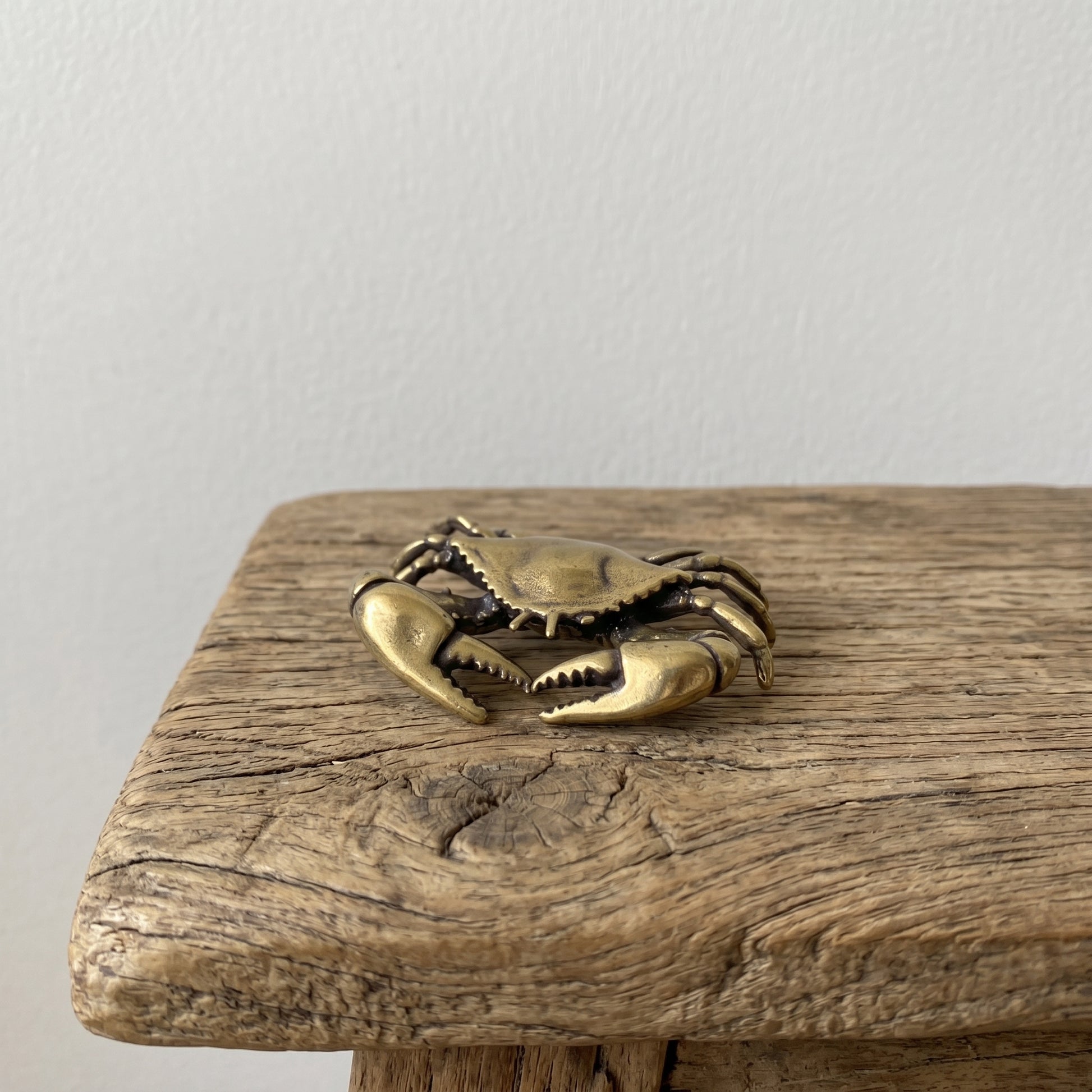 The Tide Keeper miniature solid brass crab figurine with raised claws and aged antique patina