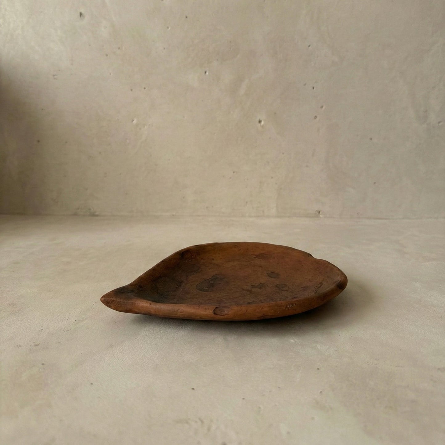 Tympew black clay betel leaf plate shown with other Sung Valley pottery pieces