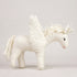 All-white hand-felted unicorn with beaded wings, a floss mane and spiralled horn, on a white background