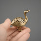 The Wild Goose brass incense burner with the openwork lid removed, showing the hollow body where incense sits