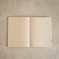 Open hand-bound journal showing acid-free handmade paper and flat-open construction, from WILLAGE