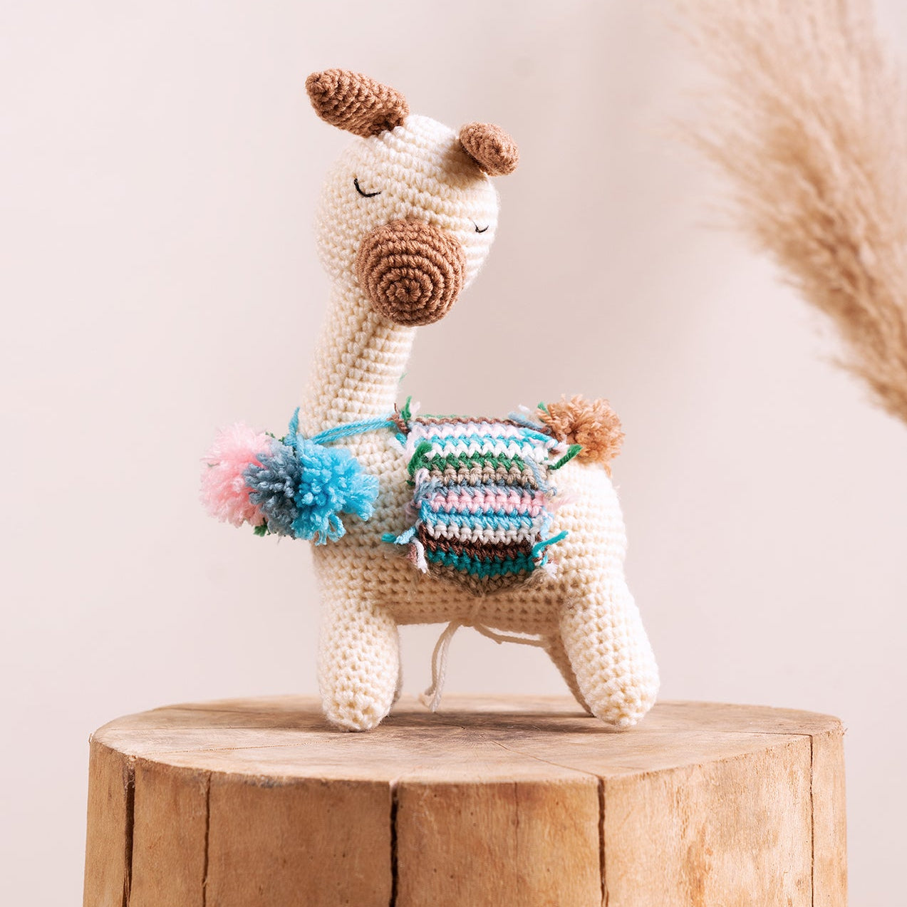 Hand-crocheted llama amigurumi showing yarn detail and hand-stitched finish, from The Hobbyt India