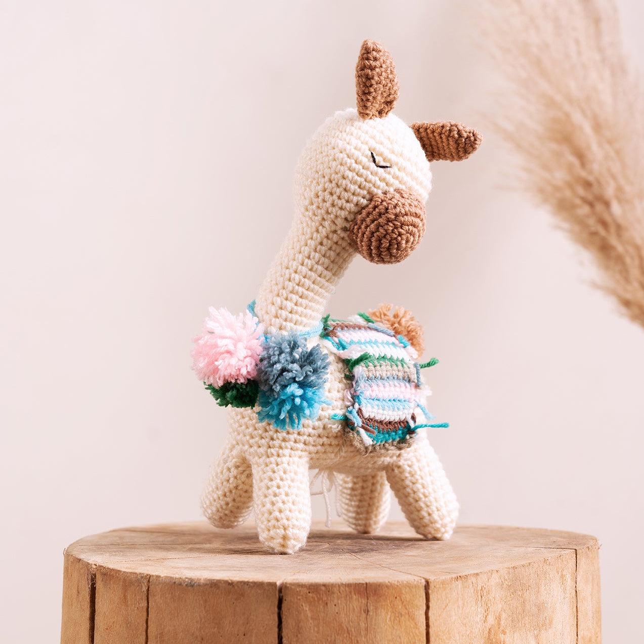 Zen Master Llama hand-crocheted amigurumi with woven blanket and pompom accents, handcrafted by The Hobbyt in India, from WILLAGE