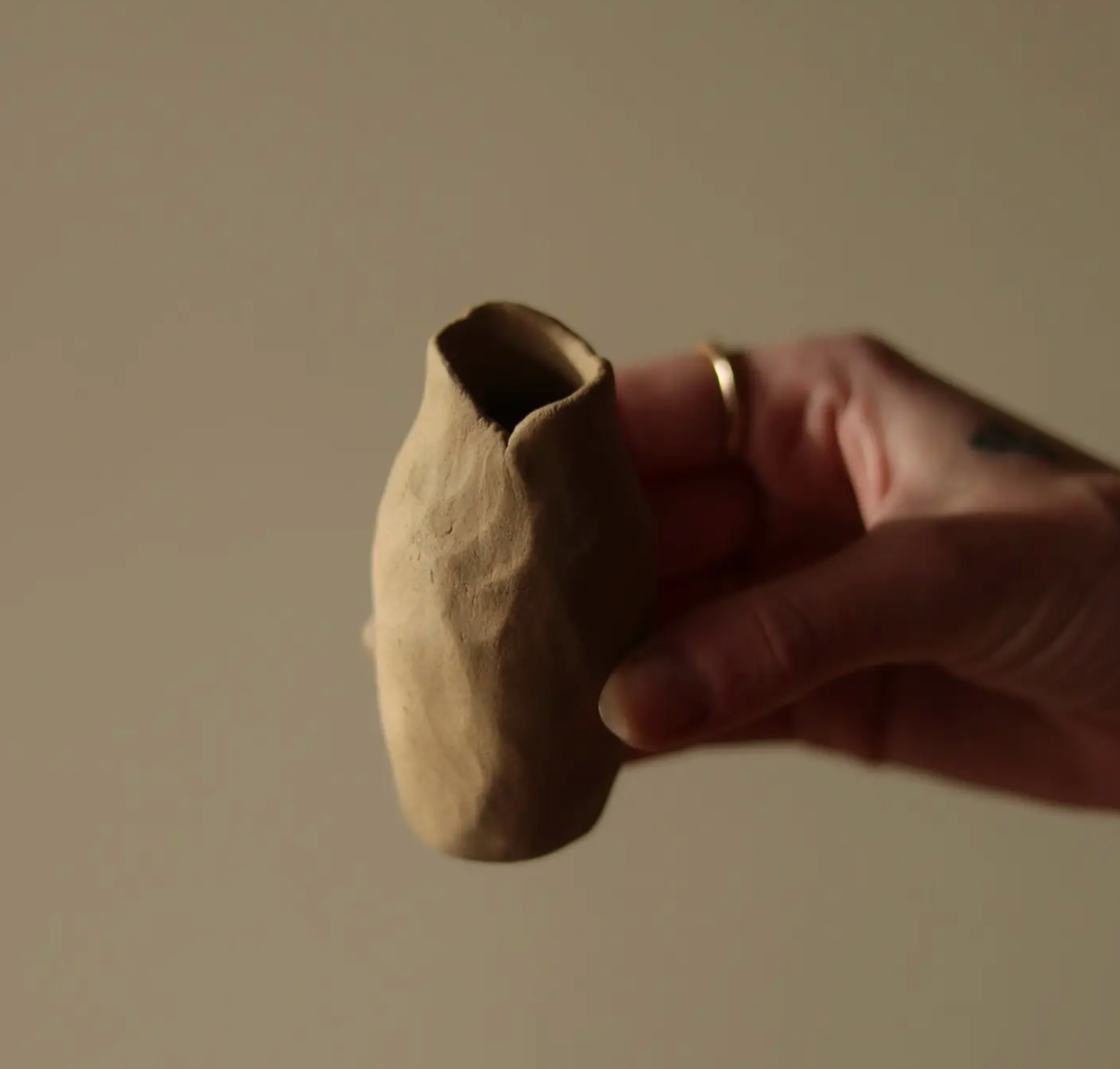 Hand-built bud vase by Conrad & Dina in Canada, raw clay sculpture