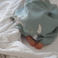 Handwoven organic linen baby blanket dyed with natural plant-based pigments.