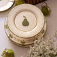 Hand-painted ceramic dessert plate with green pear motif by Raquel Souza, Portugal
