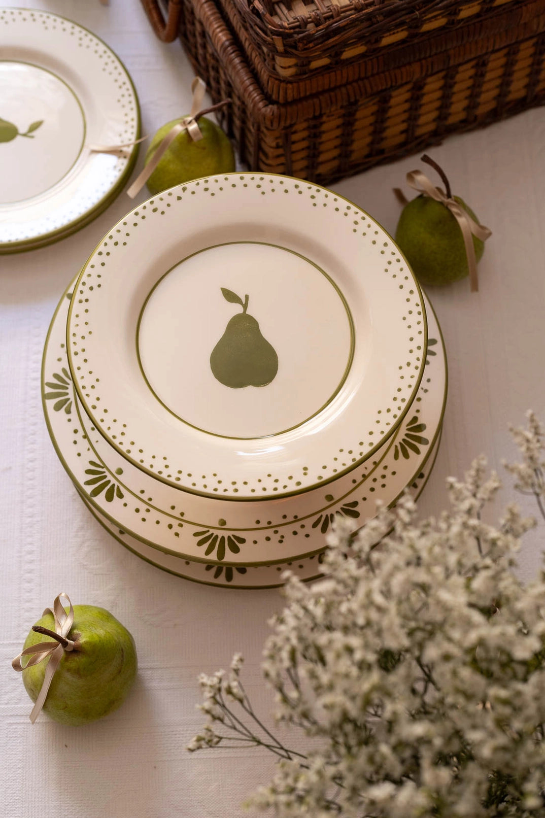 Hand-painted ceramic dessert plate with green pear motif by Raquel Souza, Portugal