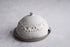 Handcrafted stoneware butter dish with crater glaze inspired by the moon