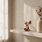 Jempinis wood mushroom sculpture styled on a shelf with dried botanicals and books, forest-inspired home decor from WILLAGE