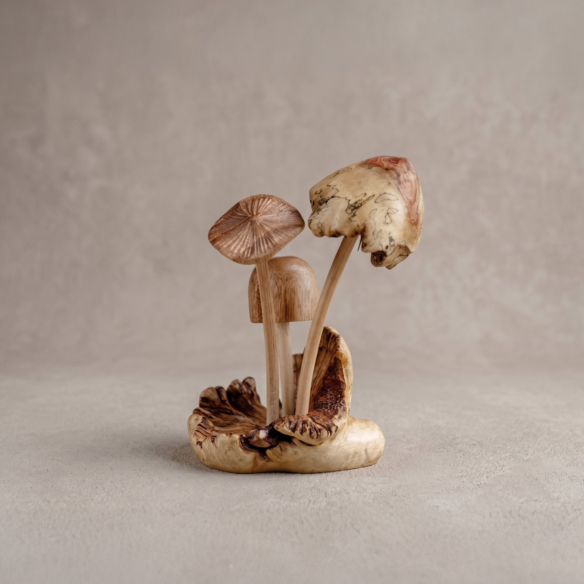 Detail of hand-carved wooden mushroom sculpture showing natural Jempinis parasite wood grain and wax finish, handcrafted in Indonesia