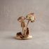 Detail of hand-carved wooden mushroom sculpture showing natural Jempinis parasite wood grain and wax finish, handcrafted in Indonesia