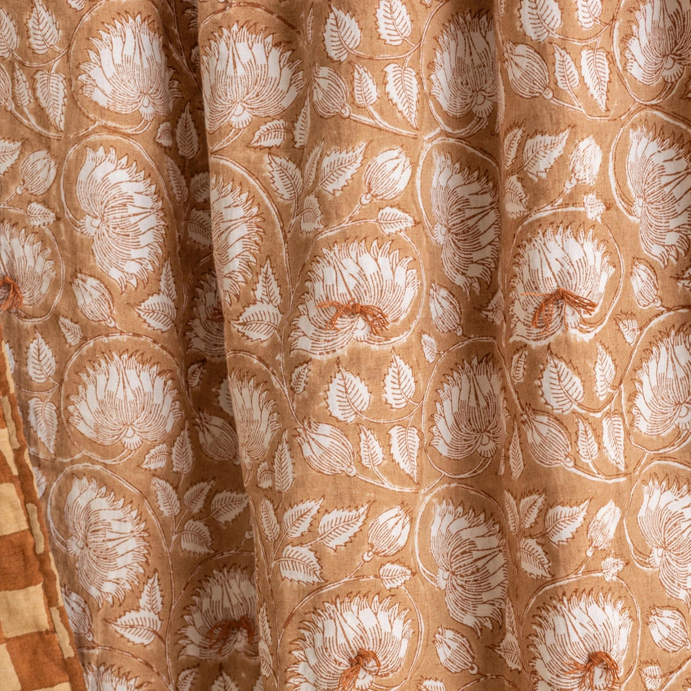 Close-up texture of Marigold European linen quilt showing hand-block printed checkerboard weave and natural fiber detail