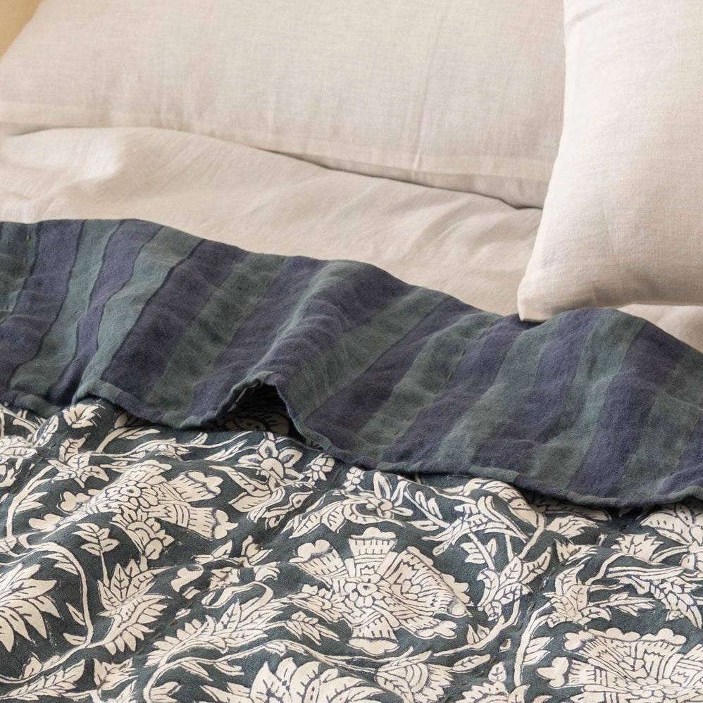 Ophelia floral linen quilt styled on king size bed with neutral pillows, hand-block printed bedding from Live Linen for WILLAGE